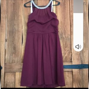 burgundy knee length cocktail dress with haltery, pearl neckline